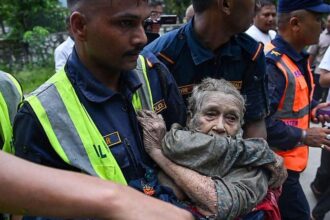 Dramatic rescue of elderly woman trapped in mud after deadly Nepal floods