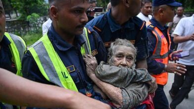 Dramatic rescue of elderly woman trapped in mud after deadly Nepal floods