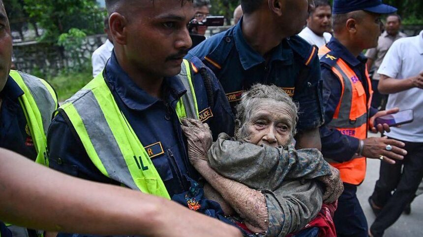 Dramatic rescue of elderly woman trapped in mud after deadly Nepal floods