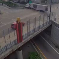 On the brink of tragedy! Semi-truck left hanging over the edge after losing its brakes