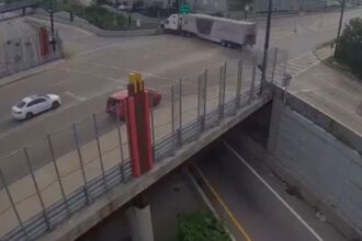 On the brink of tragedy! Semi-truck left hanging over the edge after losing its brakes