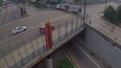 On the brink of tragedy! Semi-truck left hanging over the edge after losing its brakes