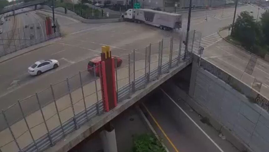 On the brink of tragedy! Semi-truck left hanging over the edge after losing its brakes