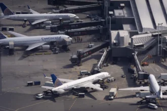 Thirteen injured after employee shuttle bus crashes into concrete barrier at Newark Airport