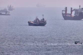 U.S. escorts 40 commercial vessels carrying 18 million barrels of oil through Strait of Hormuz amid Iran conflict