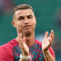 Cristiano Ronaldo jumps security barrier to take photos with two young fans