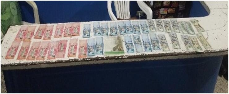 Policía apresa a dos hombres con marihuana, RD$61 mil y 960 dólares en Santiago