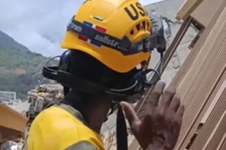 Rescatista con bandera dominicana participa en labores de búsqueda tras terremotos en Venezuela