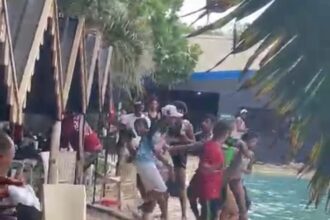 Enfrentamiento a botellazos protagonizan varias personas en piscina de Santiago; al menos siete heridos, incluyendo menores