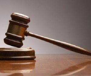 Dictan ocho meses de prisión preventiva a implicado en asalto a entidad financiera en Azua