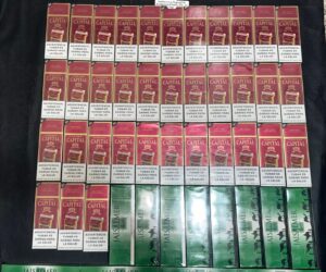 Policía y MP ocupan miles de cigarrillos ilícitos durante allanamientos en La Vega
